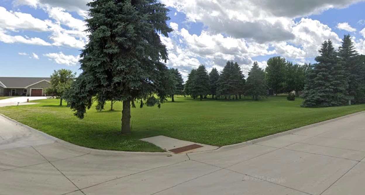 Street view of the vacant lot on the corner of 3rd Avenue North and North Oaks Court in Lake Mills, Iowa